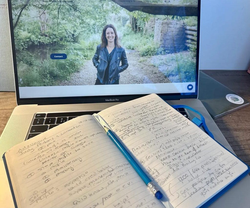 Sophie, of Sophie Seddon PR's, laptop, notepad and pencil, taking notes during an AD:VENTURE business support online workshop.
