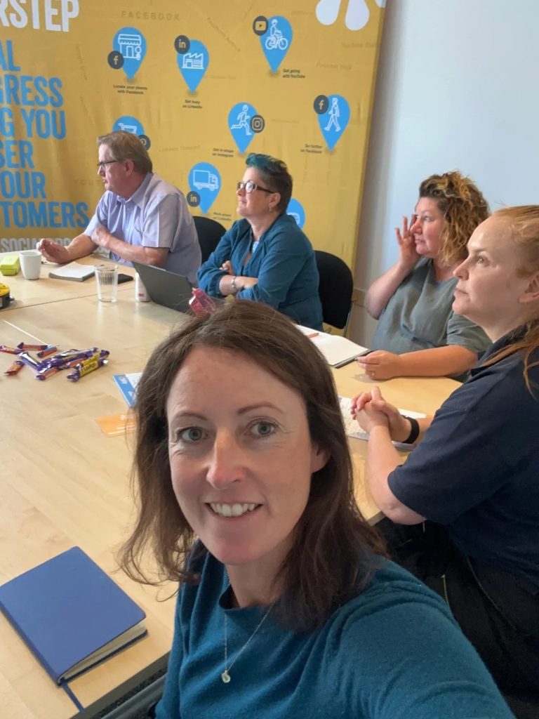 Selfie of Sophie, Sophie Seddon PR with attendees behind her at the workshop she cohosted with Janet Bebb, of Social Progress, on Christmas content creation.