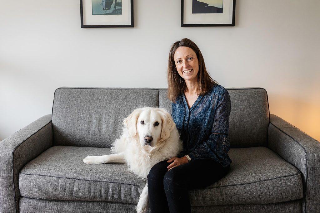 Sophie Seddon of Sophie Seddon PR at home with her golden retriever Maisie.