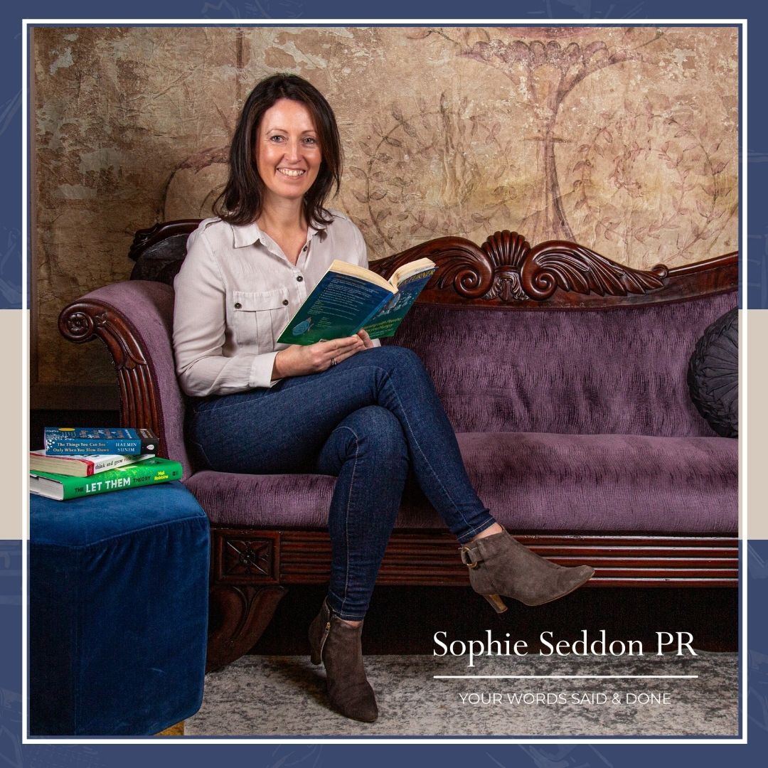Sophie Seddon at Thicket Priory photographed by Roth Read Photography, surrounded by books.